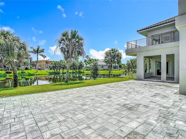 1329 Jumana Loop, Apollo Beach, FL 33572 - patio / terrace featuring a patio, a water view, a lawn, and a residential view