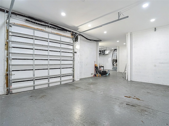 1329 Jumana Loop, Apollo Beach, FL 33572 - garage featuring recessed lighting and concrete block wall