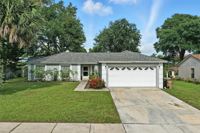 2212 Clementine Trl, Clermont, FL 34714 - single story home with an attached garage, a front lawn, a shingled roof, and concrete driveway