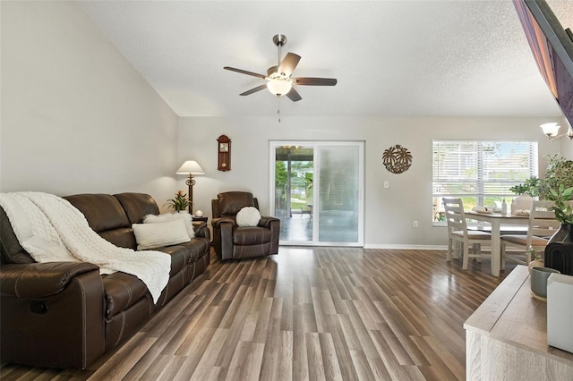 2212 Clementine Trl, Clermont, FL 34714 - living area with a ceiling fan, wood finished floors, and a chandelier