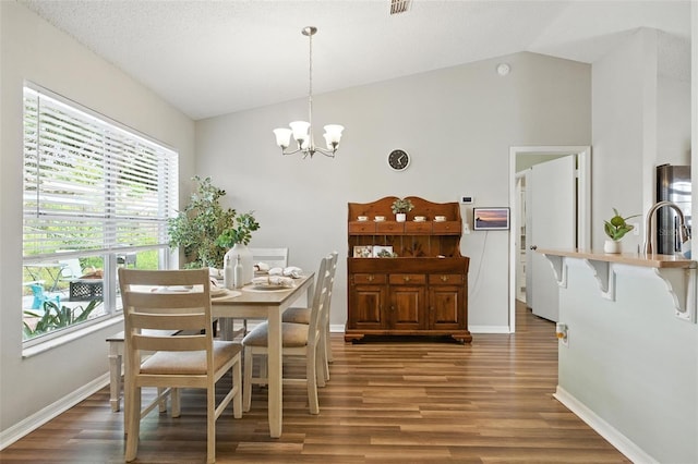 2212 Clementine Trl, Clermont, FL 34714 - dining space with wood finished floors, a chandelier, and high vaulted ceiling