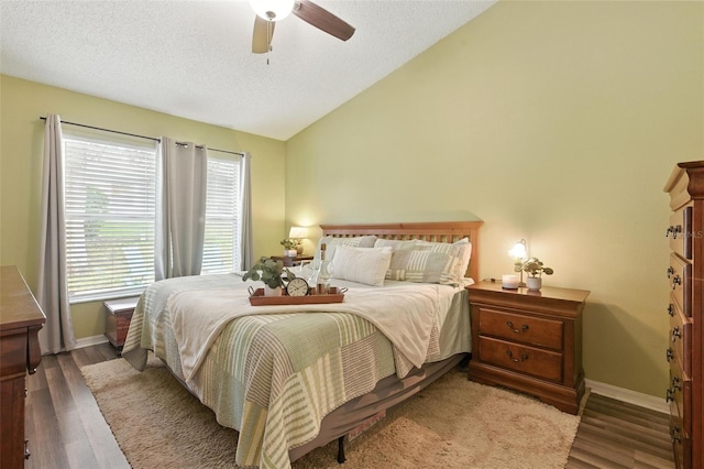 2212 Clementine Trl, Clermont, FL 34714 - bedroom featuring lofted ceiling, wood finished floors, a ceiling fan, and a textured ceiling