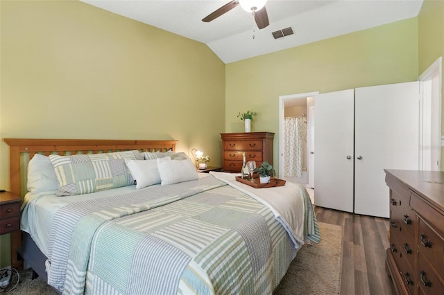 2212 Clementine Trl, Clermont, FL 34714 - bedroom with dark wood finished floors, vaulted ceiling, and ceiling fan