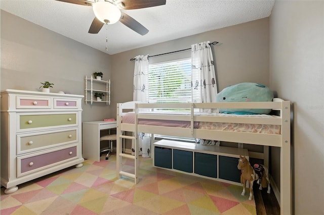 2212 Clementine Trl, Clermont, FL 34714 - bedroom with light floors, a textured ceiling, and ceiling fan