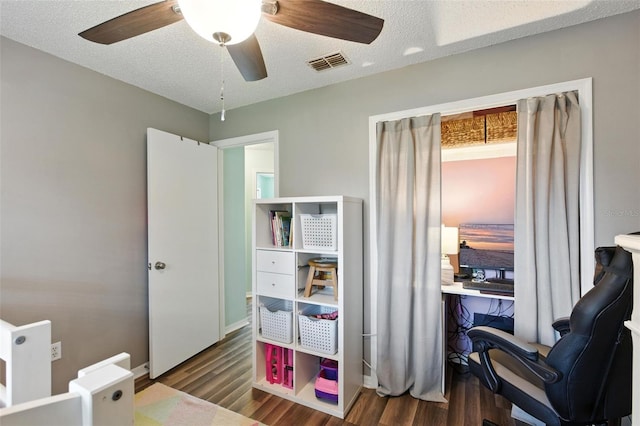 2212 Clementine Trl, Clermont, FL 34714 - bedroom featuring wood finished floors, ceiling fan, an office area, and a textured ceiling