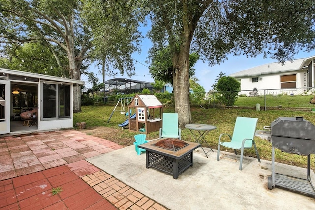 2212 Clementine Trl, Clermont, FL 34714 - view of patio featuring a playground, an outdoor fire pit, and grilling area