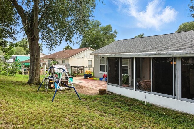 2212 Clementine Trl, Clermont, FL 34714 - view of yard featuring a patio and a sunroom