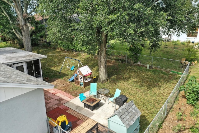 2212 Clementine Trl, Clermont, FL 34714 - view of yard featuring a playground, a fire pit, and a patio