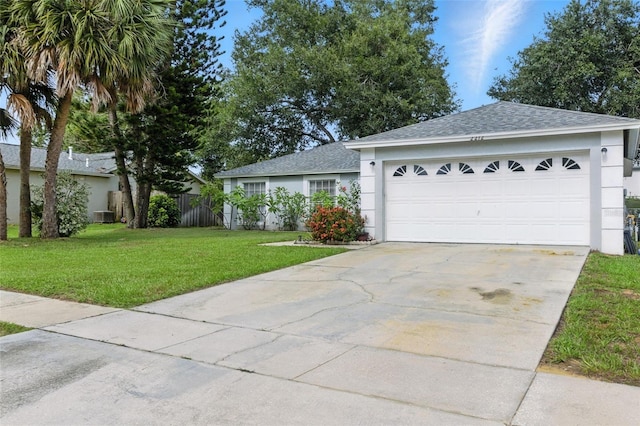 2212 Clementine Trl, Clermont, FL 34714 - ranch-style house featuring stucco siding, concrete driveway, roof with shingles, and a garage