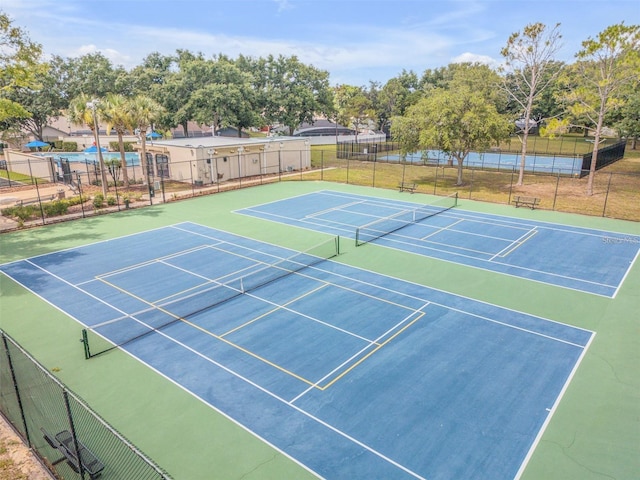 2212 Clementine Trl, Clermont, FL 34714 - view of tennis court featuring community basketball court