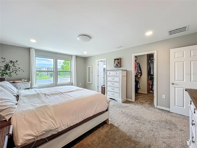 1808 Regal River Cir, Ocoee, FL 34761 - bedroom with light carpet, a walk in closet, recessed lighting, and a closet