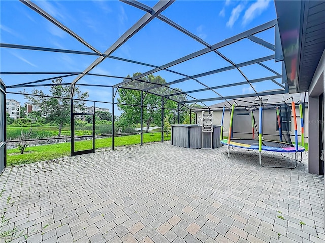 1808 Regal River Cir, Ocoee, FL 34761 - view of patio with a trampoline, glass enclosure, and a jacuzzi