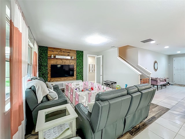 1808 Regal River Cir, Ocoee, FL 34761 - living room featuring an accent wall, stairway, and recessed lighting