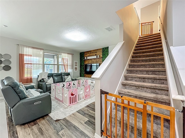 1808 Regal River Cir, Ocoee, FL 34761 - staircase with wood finished floors and a textured ceiling