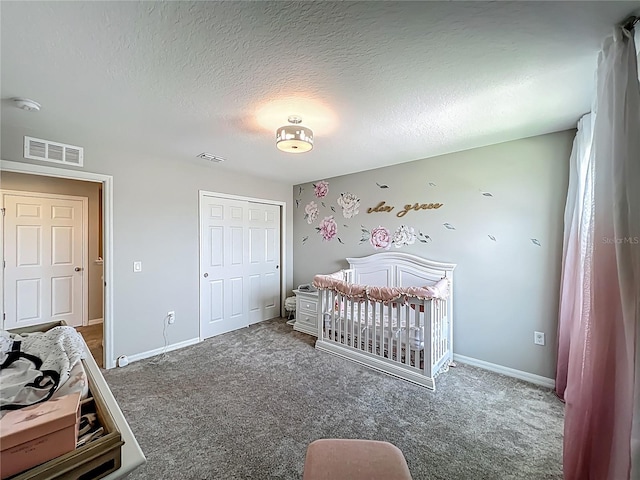 1808 Regal River Cir, Ocoee, FL 34761 - bedroom featuring carpet floors, a closet, a textured ceiling, and a crib