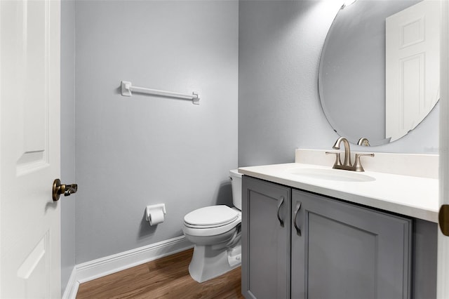 2495 Squaw Crk, Clermont, FL 34711 - half bathroom featuring vanity and wood finished floors
