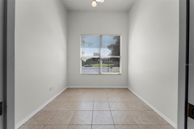 2495 Squaw Crk, Clermont, FL 34711 - empty room featuring light tile patterned floors and baseboards
