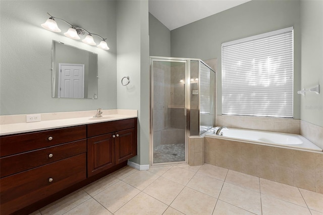 2495 Squaw Crk, Clermont, FL 34711 - full bath with vanity, tile patterned flooring, a bath, a shower stall, and lofted ceiling