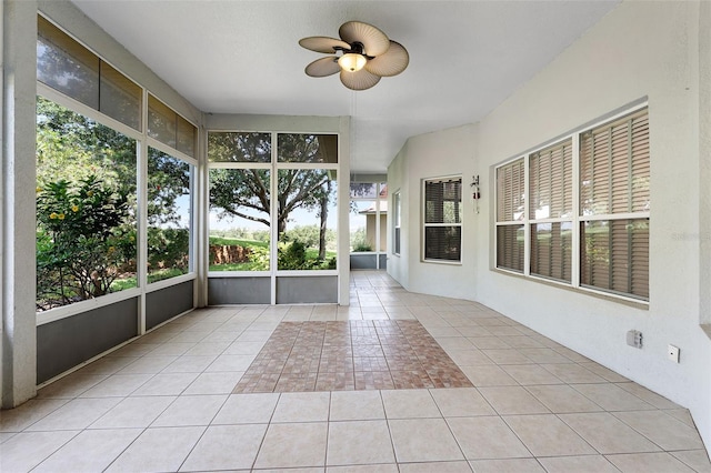 2495 Squaw Crk, Clermont, FL 34711 - unfurnished sunroom featuring ceiling fan and plenty of natural light