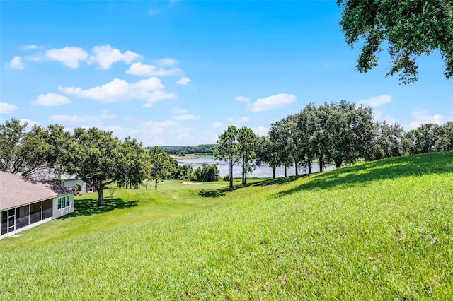 2495 Squaw Crk, Clermont, FL 34711 - view of green lawn featuring a water view and a sunroom