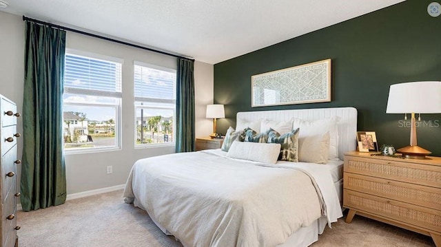 3045 Skyline Loop, Kissimmee, FL 34758 - bedroom featuring light carpet and multiple windows