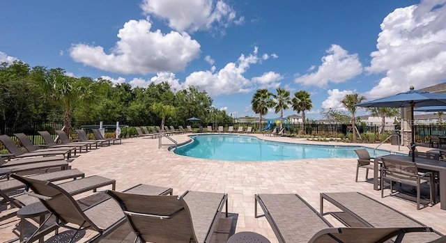 3045 Skyline Loop, Kissimmee, FL 34758 - community pool featuring a patio area