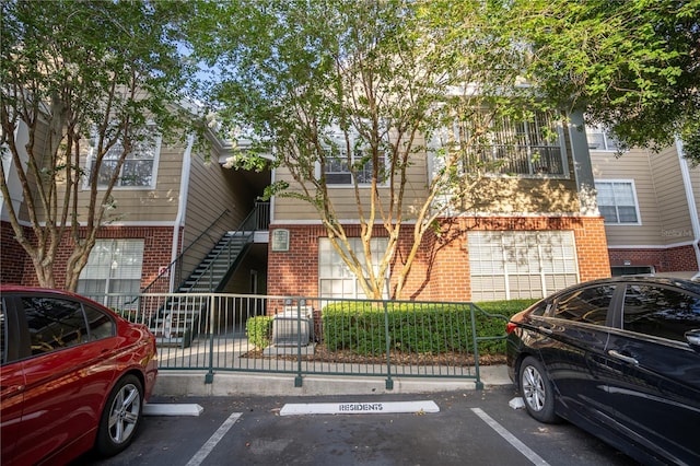 13037 Mulberry Park Dr Unit 5211, Orlando, FL 32821 - view of property featuring uncovered parking