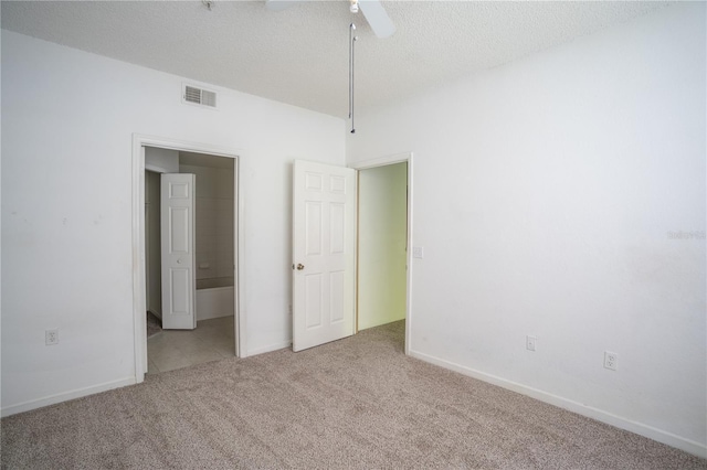 13037 Mulberry Park Dr Unit 5211, Orlando, FL 32821 - empty room featuring carpet floors, a ceiling fan, and a textured ceiling