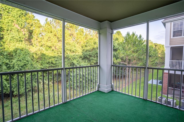 13037 Mulberry Park Dr Unit 5211, Orlando, FL 32821 - unfurnished sunroom with a view of trees