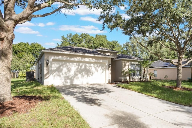 988 Vanderbilt Dr, Eustis, FL 32726 - single story home with an attached garage, concrete driveway, a front yard, and stucco siding