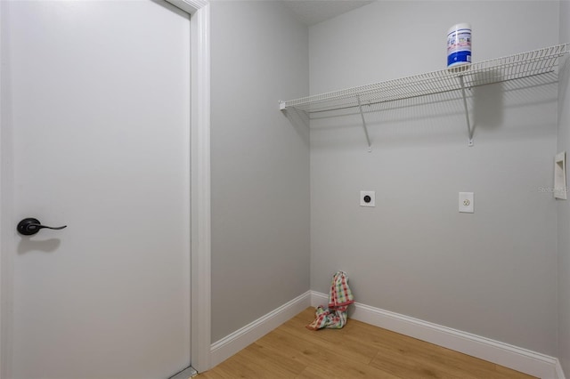 988 Vanderbilt Dr, Eustis, FL 32726 - laundry area featuring hookup for an electric dryer and light wood-style floors