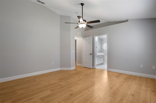 988 Vanderbilt Dr, Eustis, FL 32726 - unfurnished bedroom with vaulted ceiling, light wood-style flooring, ensuite bathroom, and a ceiling fan