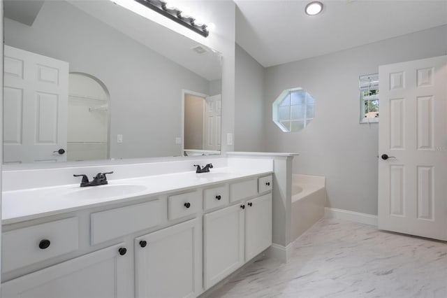 988 Vanderbilt Dr, Eustis, FL 32726 - full bathroom with double vanity, marble finish floors, and a bath