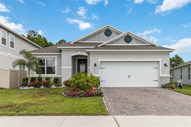16400 Winding Preserve Cir, Clermont, FL 34714 - ranch-style house with driveway, an attached garage, a front yard, and roof with shingles