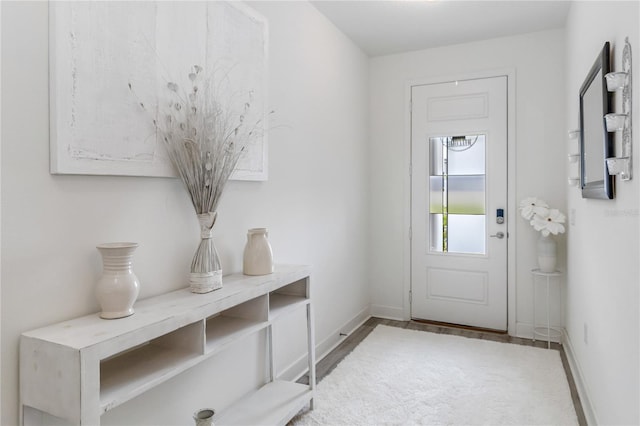 16400 Winding Preserve Cir, Clermont, FL 34714 - doorway to outside featuring baseboards