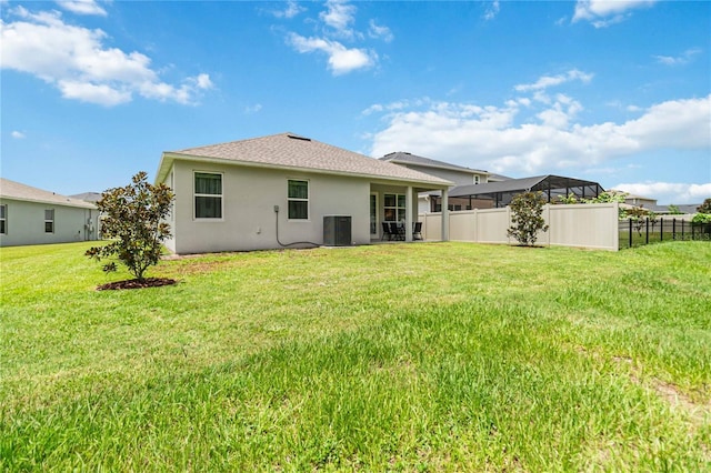 16400 Winding Preserve Cir, Clermont, FL 34714 - rear view of property with stucco siding and a shingled roof