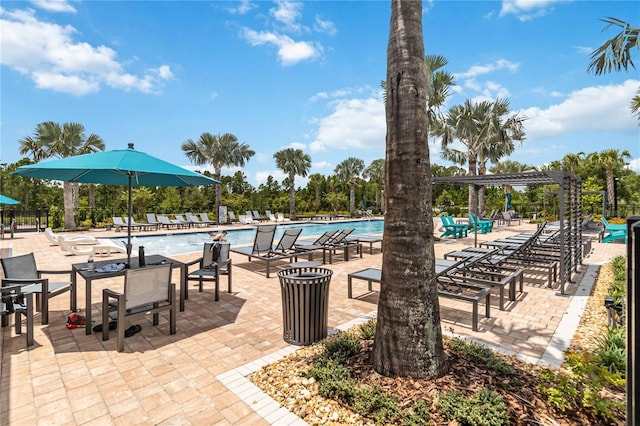 16400 Winding Preserve Cir, Clermont, FL 34714 - community pool with a pergola and a patio