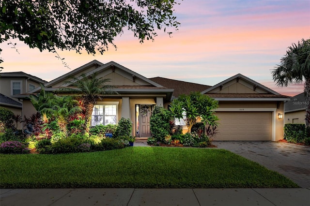 1208 Fieldstone Cir, Oviedo, FL 32765 - view of front of house featuring decorative driveway, a lawn, an attached garage, and stucco siding