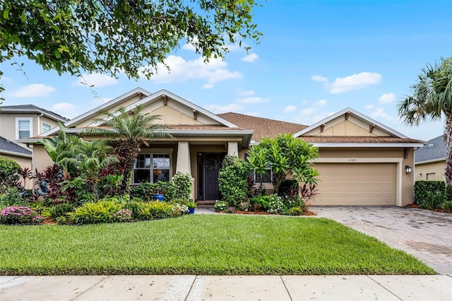 1208 Fieldstone Cir, Oviedo, FL 32765 - view of front facade featuring a garage, a front yard, stucco siding, and decorative driveway