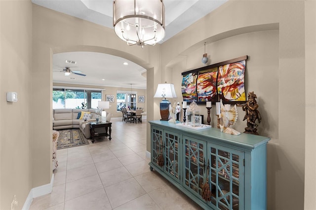 1208 Fieldstone Cir, Oviedo, FL 32765 - corridor with arched walkways, a chandelier, tile patterned floors, and recessed lighting