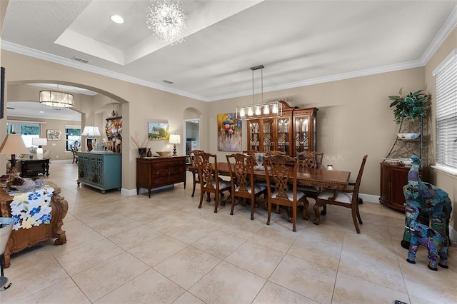 1208 Fieldstone Cir, Oviedo, FL 32765 - dining area with arched walkways, light tile patterned flooring, a chandelier, plenty of natural light, and ornamental molding