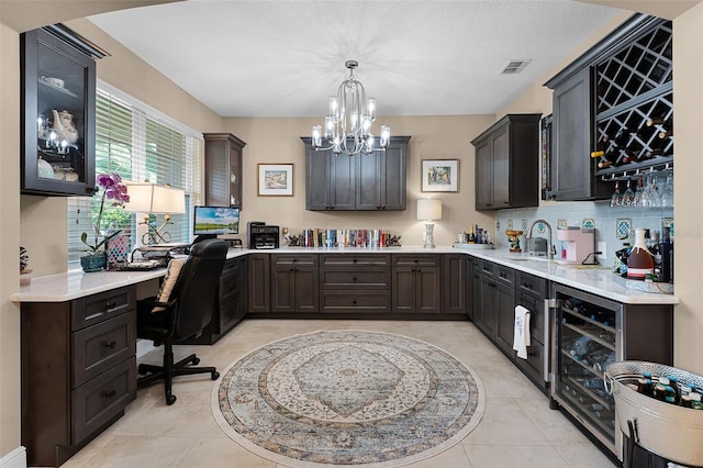 1208 Fieldstone Cir, Oviedo, FL 32765 - office with wine cooler, a chandelier, light tile patterned flooring, and built in study area