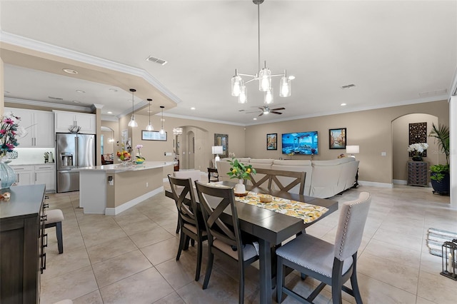 1208 Fieldstone Cir, Oviedo, FL 32765 - dining space with arched walkways, light tile patterned floors, ornamental molding, a chandelier, and recessed lighting