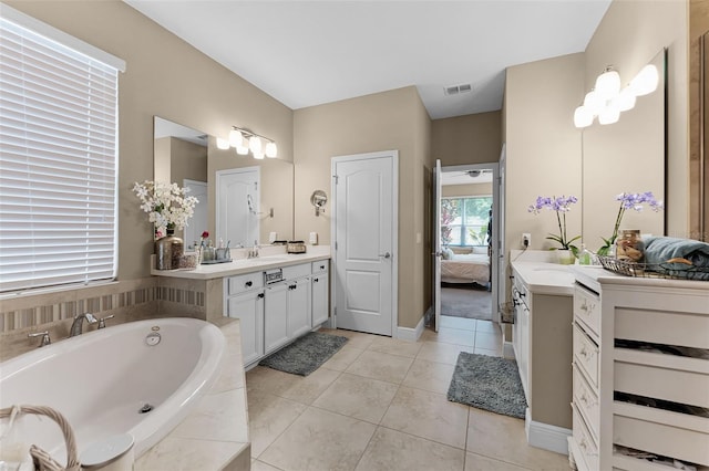 1208 Fieldstone Cir, Oviedo, FL 32765 - ensuite bathroom featuring vanity, a garden tub, and tile patterned floors