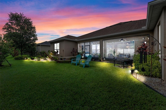 1208 Fieldstone Cir, Oviedo, FL 32765 - rear view of house with stucco siding and a lawn