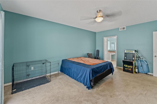 1305 Rebecca Dr, Haines City, FL 33844 - carpeted bedroom with a textured ceiling, a ceiling fan, and connected bathroom