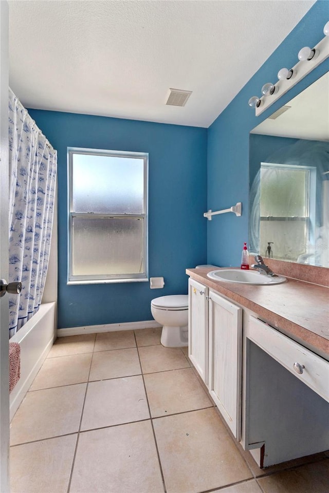 1305 Rebecca Dr, Haines City, FL 33844 - full bathroom with vanity, tile patterned floors, shower / tub combo, and a textured ceiling