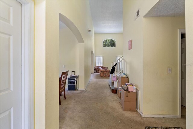 1305 Rebecca Dr, Haines City, FL 33844 - hall with arched walkways and carpet