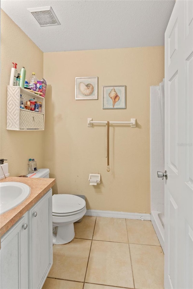 1305 Rebecca Dr, Haines City, FL 33844 - bathroom featuring vanity, tile patterned flooring, a shower with shower curtain, and a textured ceiling