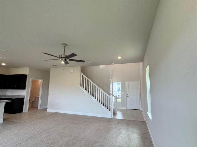 4101 Sagefield Dr, Harmony, FL 34773 - unfurnished living room featuring stairway, light colored carpet, a ceiling fan, and recessed lighting